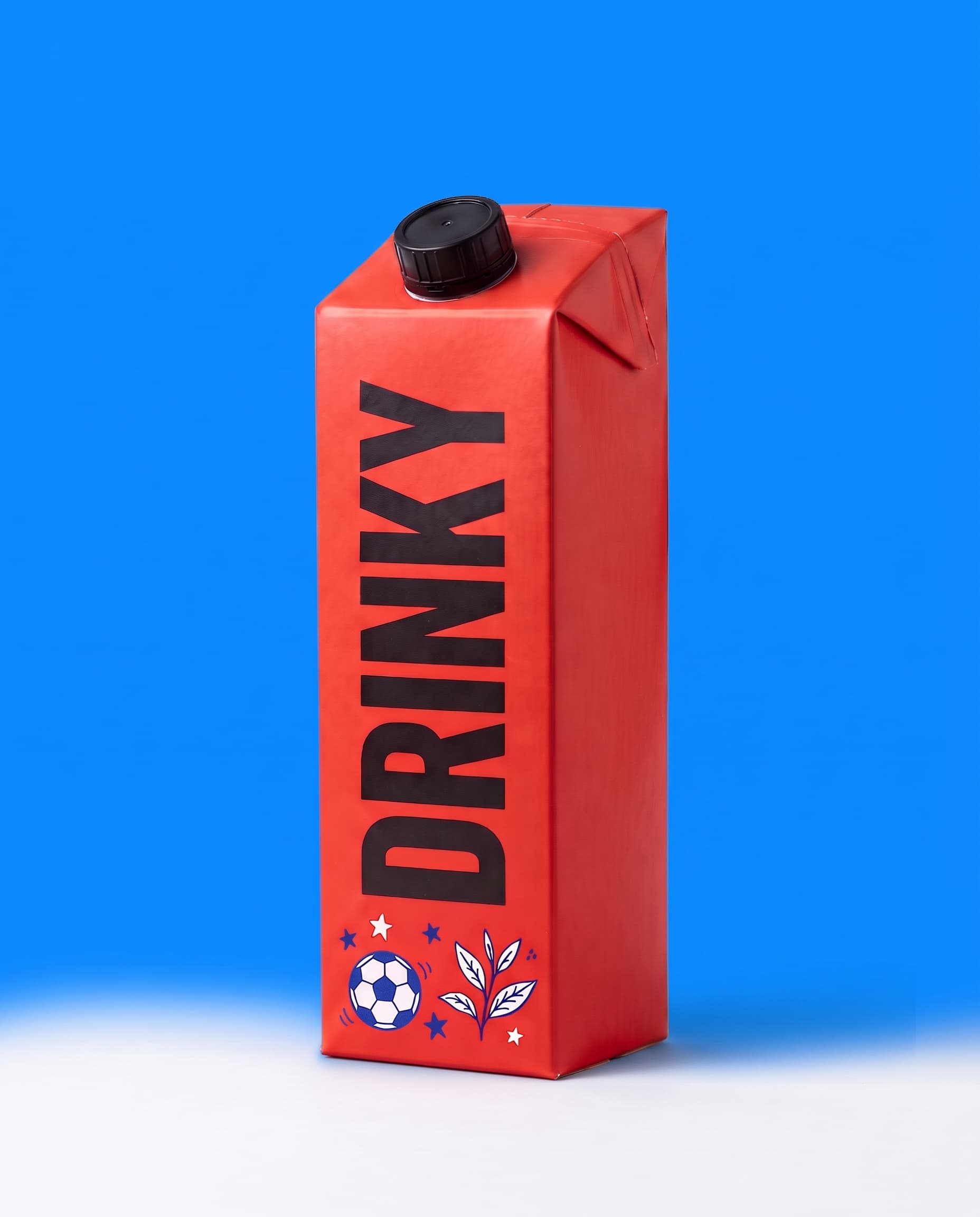 A red DRINKY carton with a black cap on a blue background