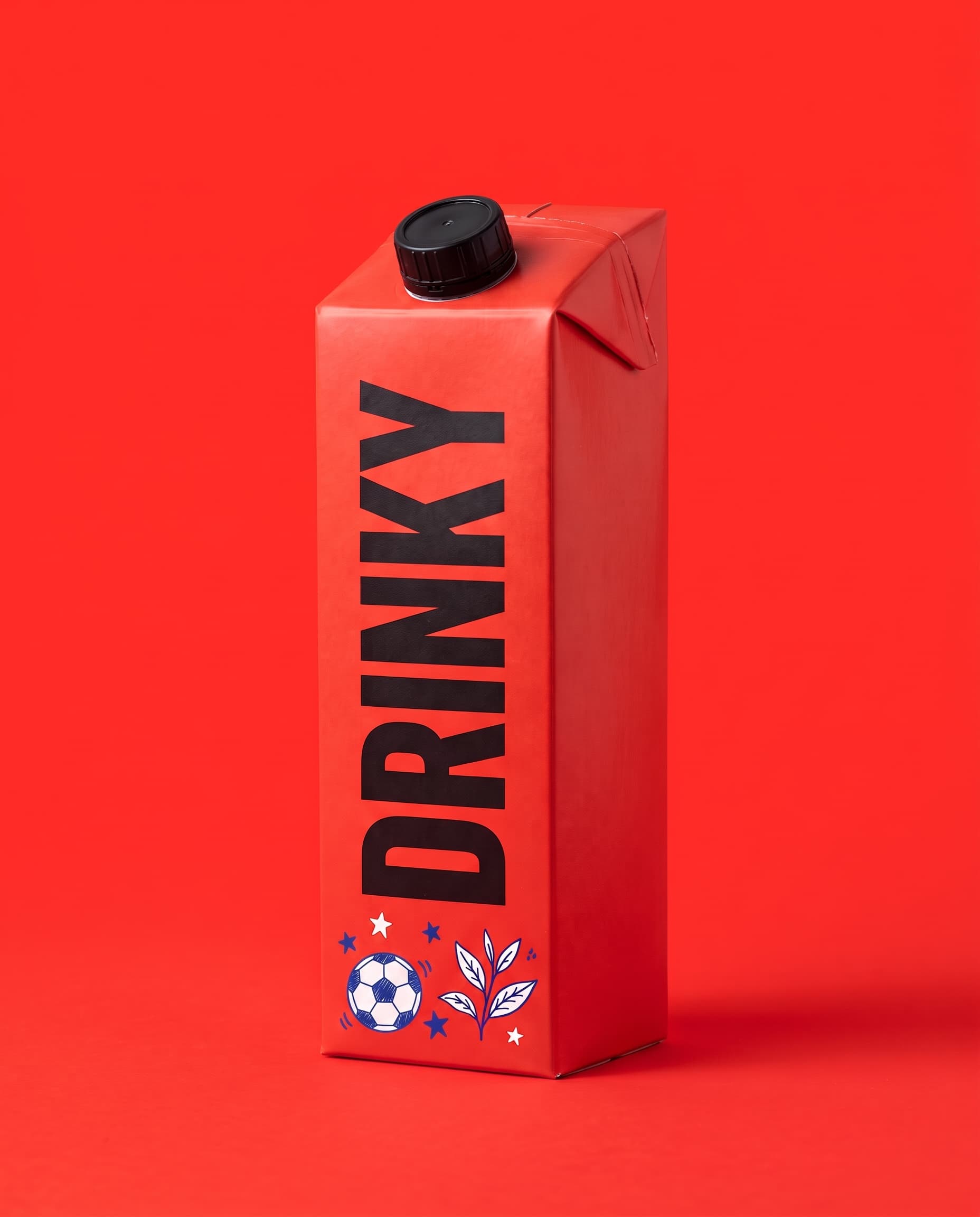 A red DRINKY carton with a black cap on a red background